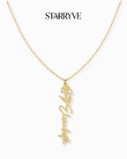 Gold flower name necklace with a birth flower charm and cursive name pendant on a fine chain