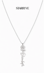 Silver flower name necklace with a birth flower charm and cursive name pendant on a fine chain