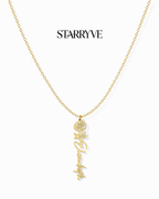Silver flower name necklace with a birth flower charm and cursive name pendant on a fine chain