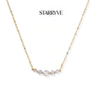 Golden arc necklace with five graduated cubic zirconia stones