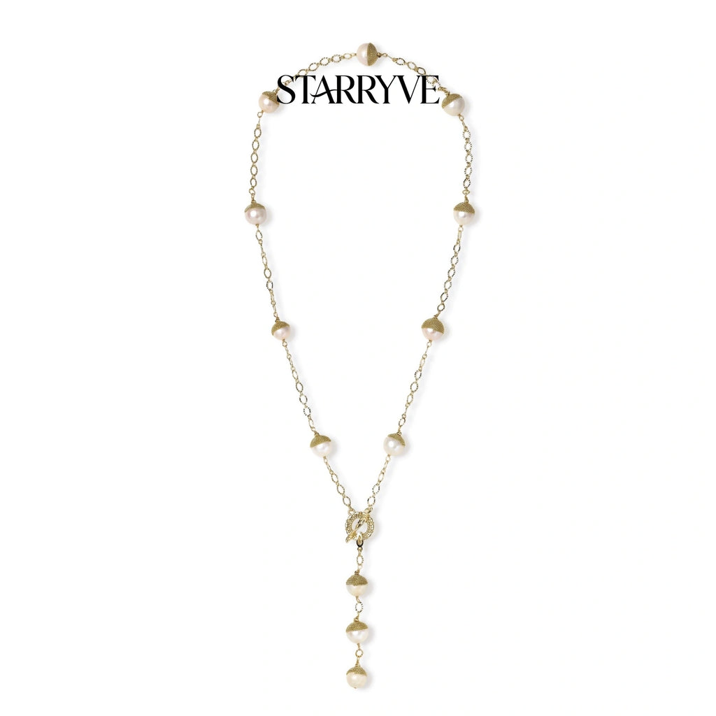 Baroque pearl station lariat necklace with gold textured pearl caps