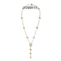 Baroque pearl station lariat necklace with gold textured pearl caps