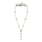 Baroque pearl station lariat necklace with gold textured pearl caps