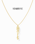 Gold flower name necklace with a birth flower charm and cursive name pendant on a fine chain