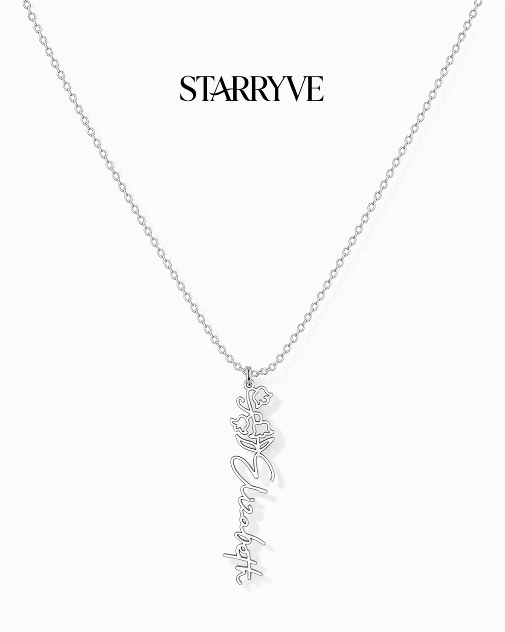 Silver flower name necklace with a birth flower charm and cursive name pendant on a fine chain
