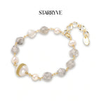 Baroque pearl crystal bracelet with grey gemstone beads and a gold coil-wrapped pearl