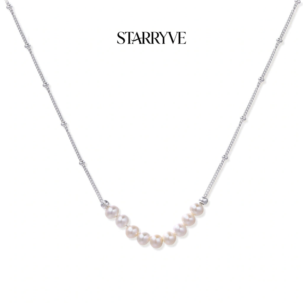 Luna Pearl Arc Necklace with STARRYVE logo