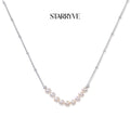 Luna Pearl Arc Necklace with STARRYVE logo
