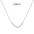 Luna Pearl Arc Necklace with STARRYVE logo