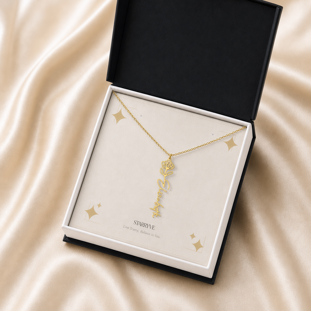 Gold flower name necklace with the November chrysanthemum birth flower, shown in a black standard gift box