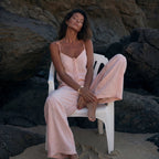 Woman wearing the golden manifest bracelet as part of a full look