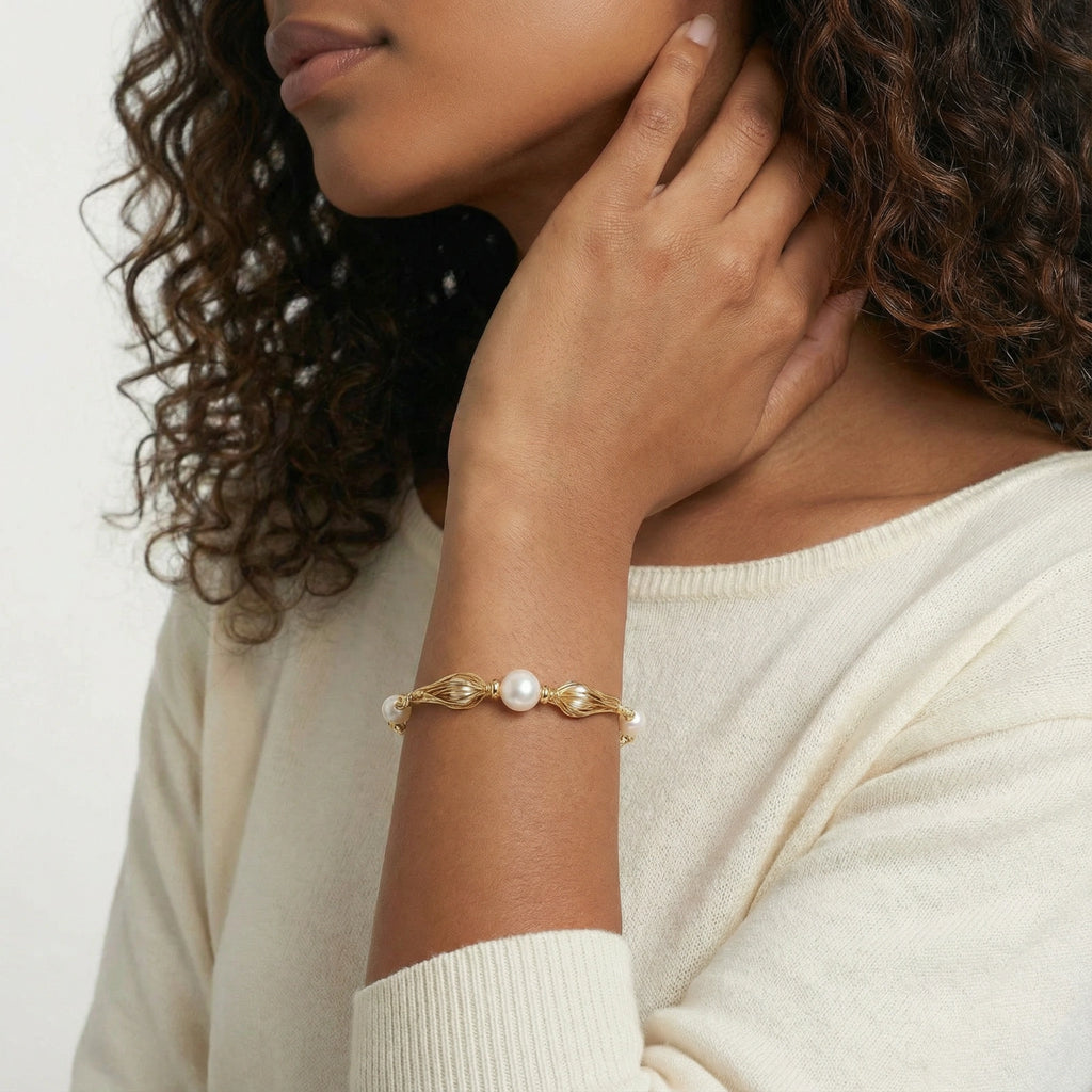 Flat lay of the golden spiral pearl bracelet