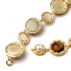 Close-up of the tiger's eye pearl wisdom bracelet on a wrist