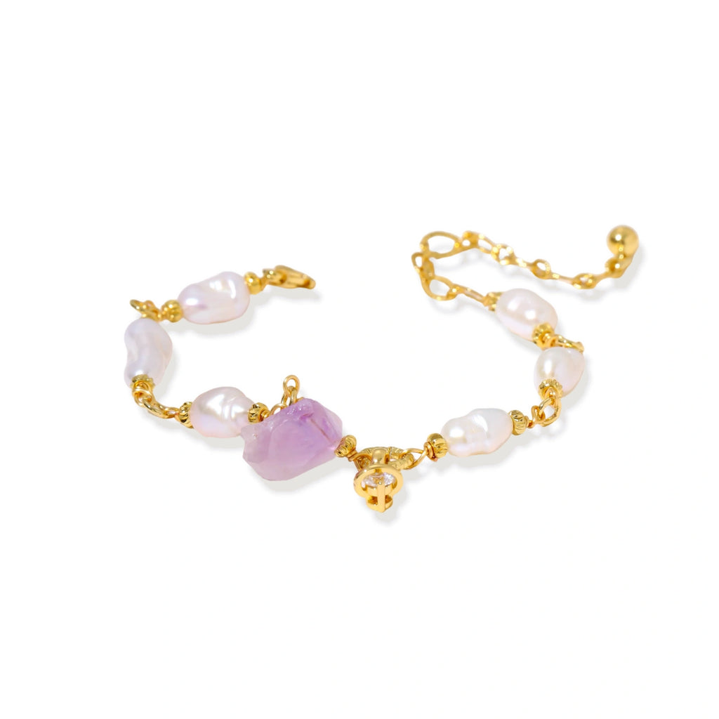 Flat lay of the amethyst and pearl bracelet