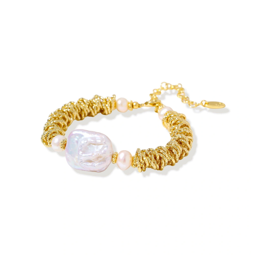 Close-up of the spiral dreams bracelet showing the baroque pearl centerpiece