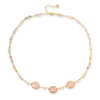 Woman wearing the garden dreams healing necklace at the neckline