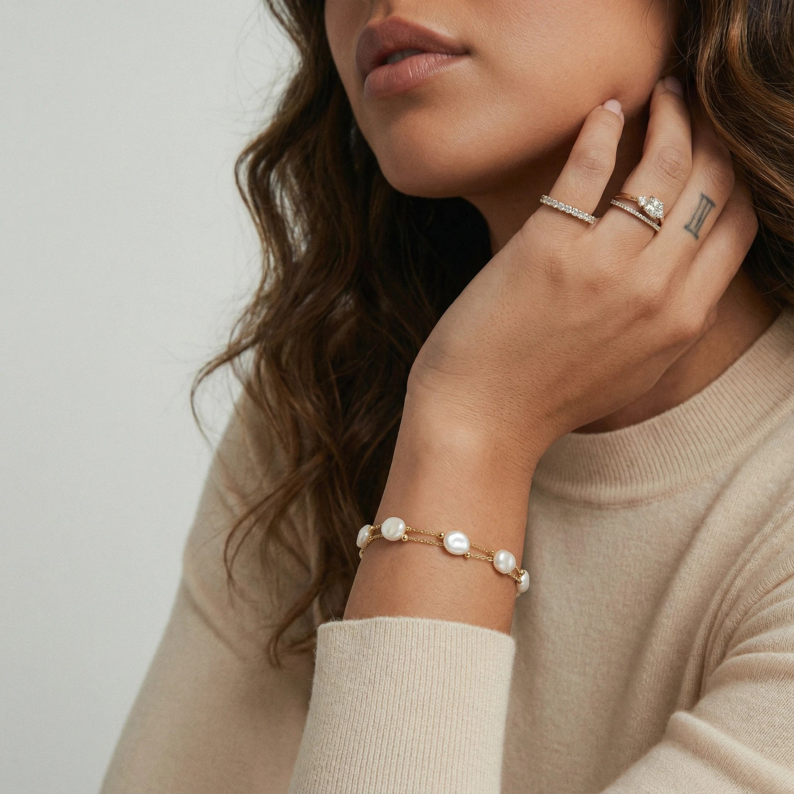 Close-up of the baroque pearl layered bracelet on the wrist