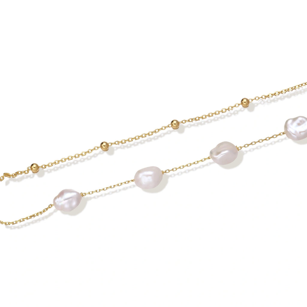 Flat lay of the baroque pearl double chain bracelet