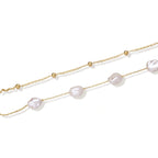 Flat lay of the baroque pearl double chain bracelet