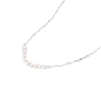 Model wearing Luna Pearl Arc Necklace