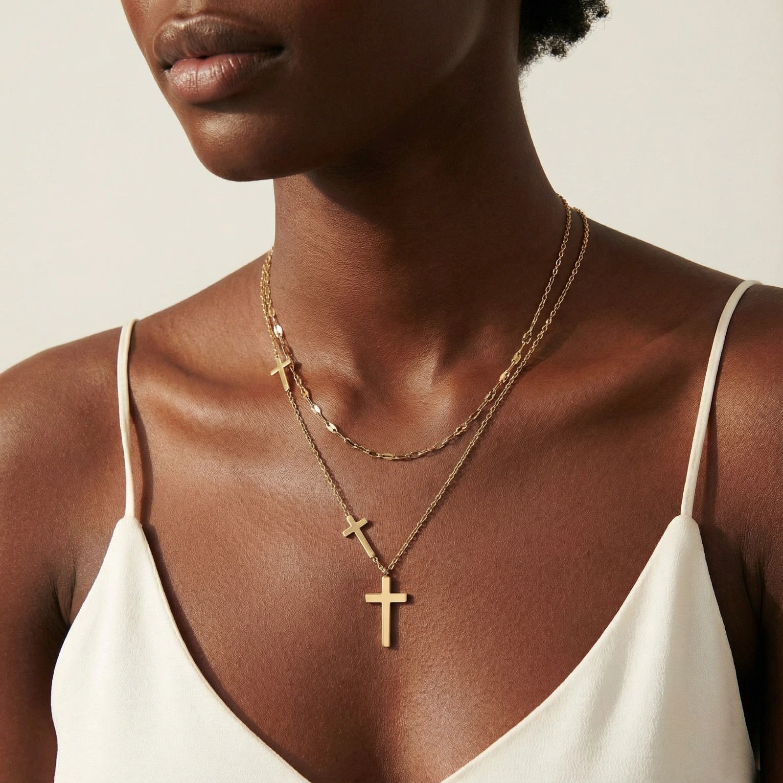 Model wearing Divine Layers Cross Necklace Set