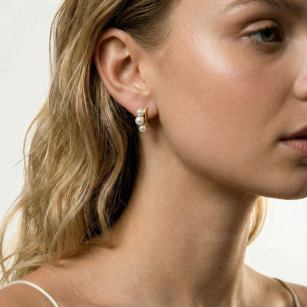Model wearing Pearl Trio Curve Studs