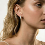 Model wearing Pearl Trio Curve Studs
