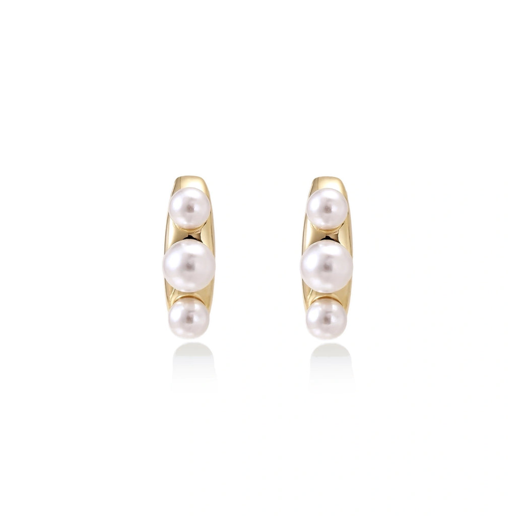 Model wearing Pearl Trio Curve Studs