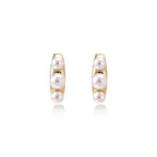 Model wearing Pearl Trio Curve Studs