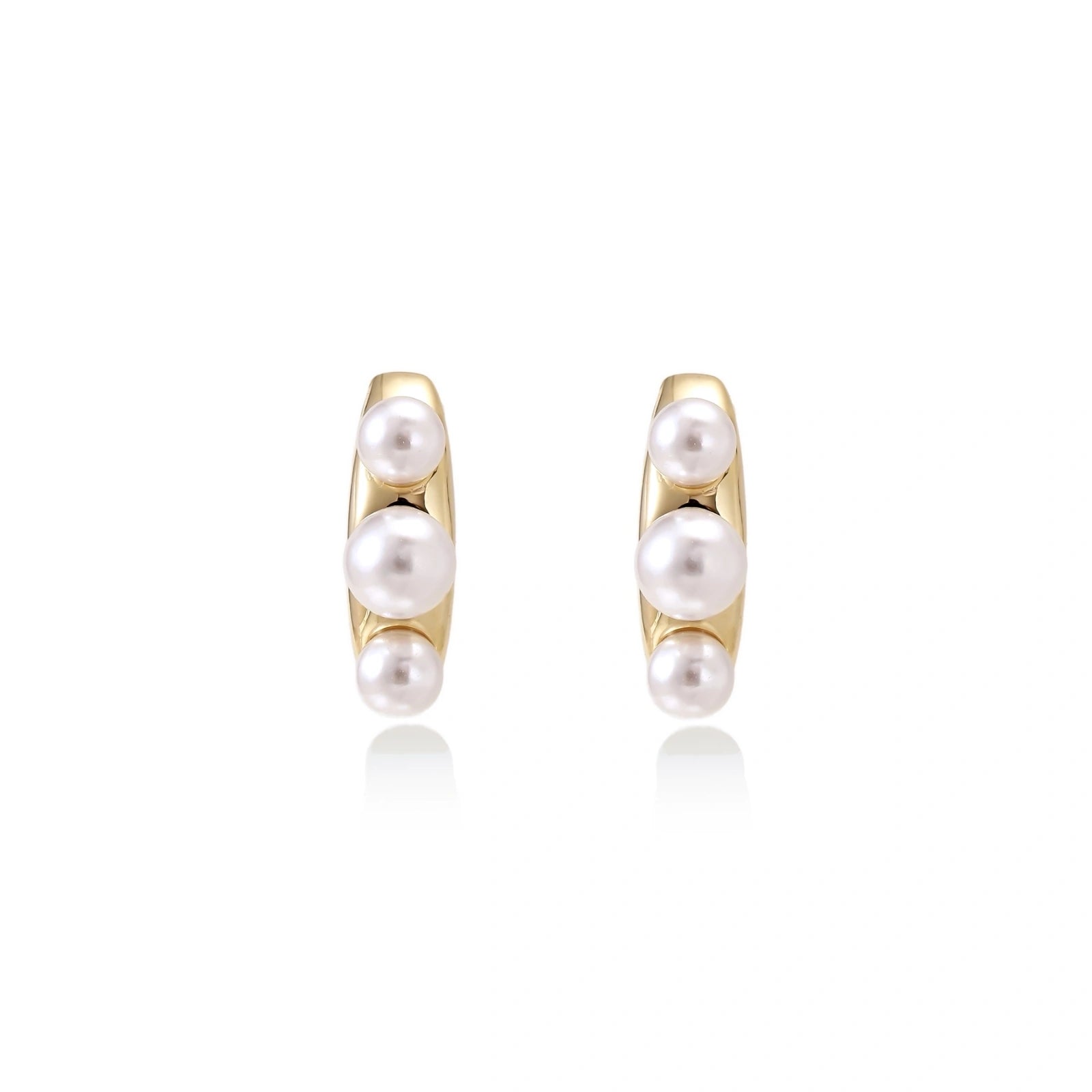 Model wearing Pearl Trio Curve Studs