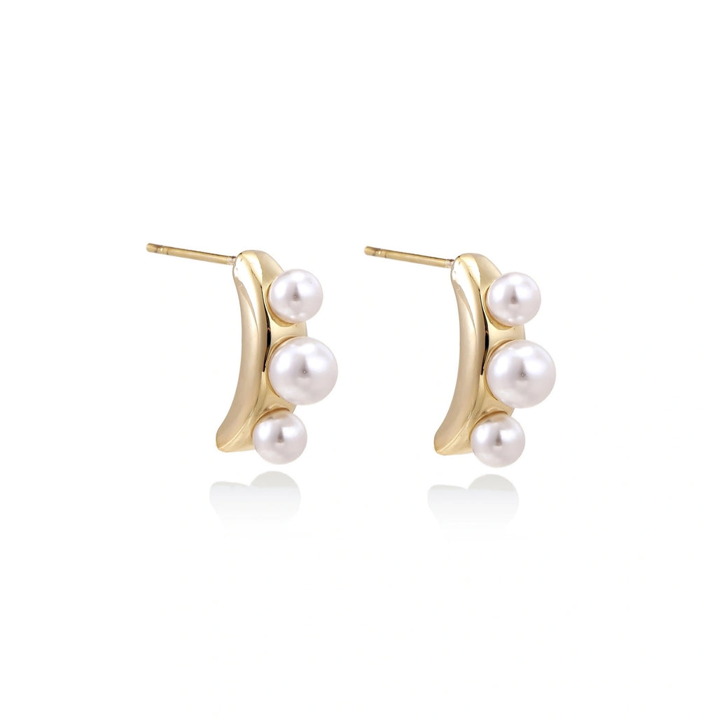 Model wearing Pearl Trio Curve Studs
