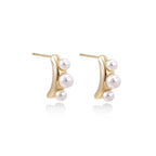Model wearing Pearl Trio Curve Studs