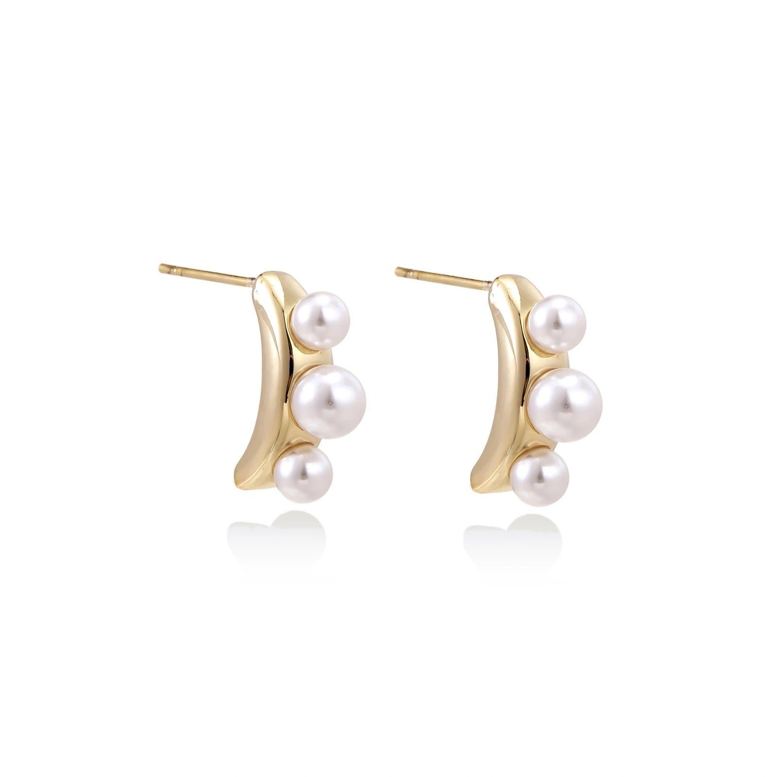 Model wearing Pearl Trio Curve Studs
