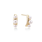 Model wearing Pearl Trio Curve Studs