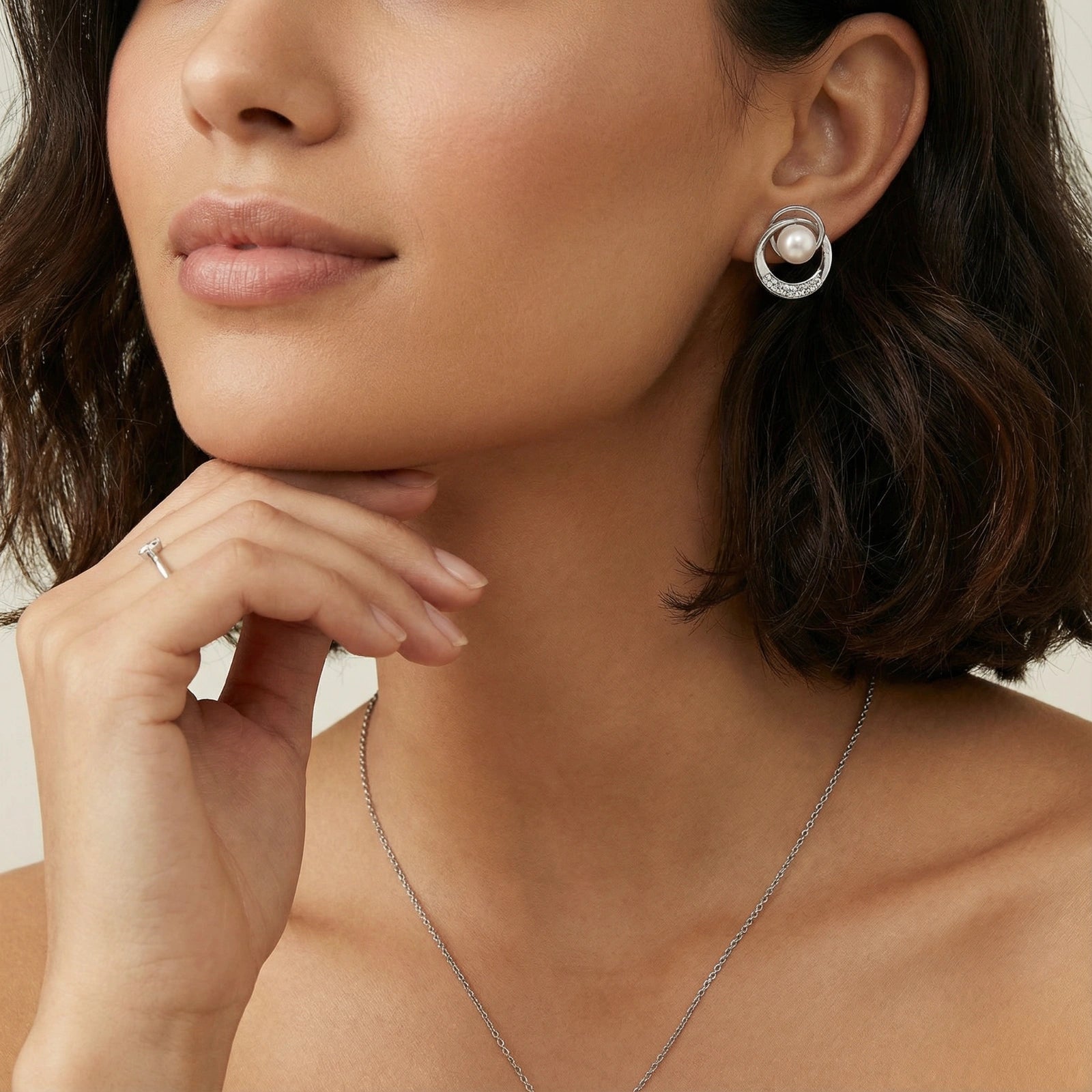 Model wearing Pearl Orbit Studs