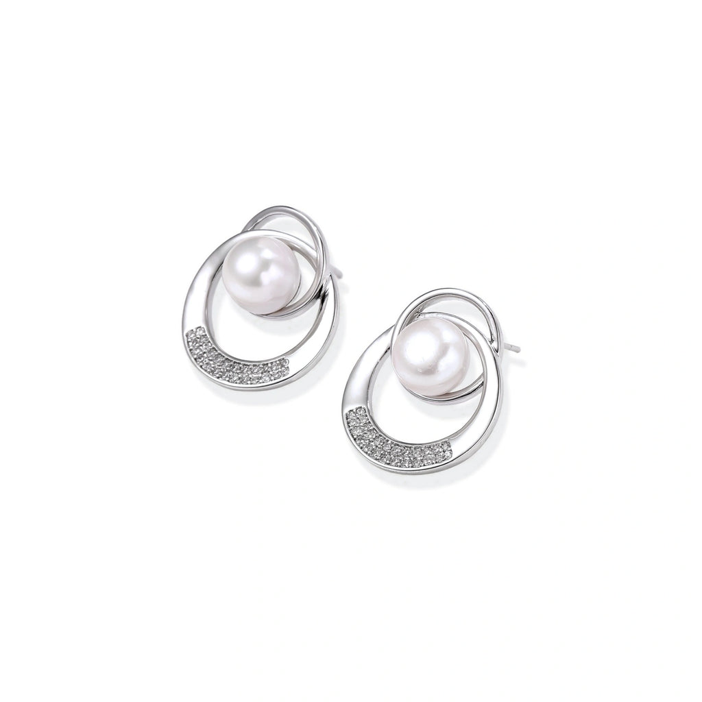 Model wearing Pearl Orbit Studs
