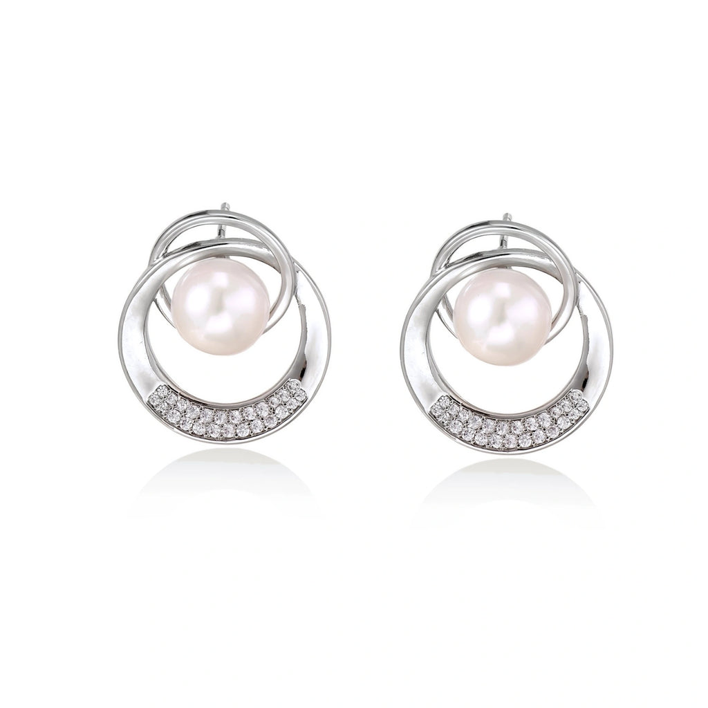 Model wearing Pearl Orbit Studs