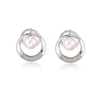 Model wearing Pearl Orbit Studs