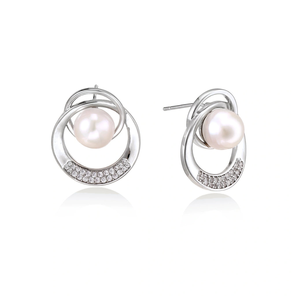 Model wearing Pearl Orbit Studs