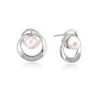 Model wearing Pearl Orbit Studs