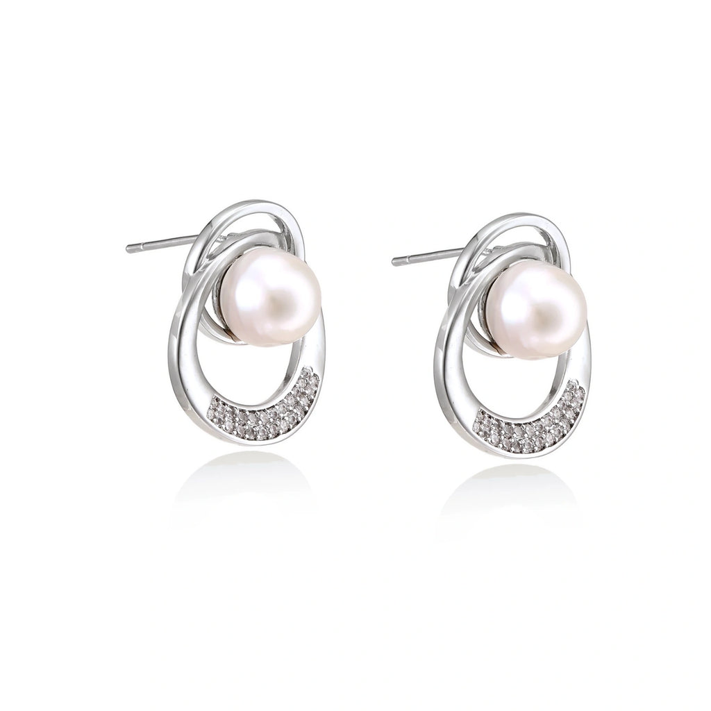 Model wearing Pearl Orbit Studs