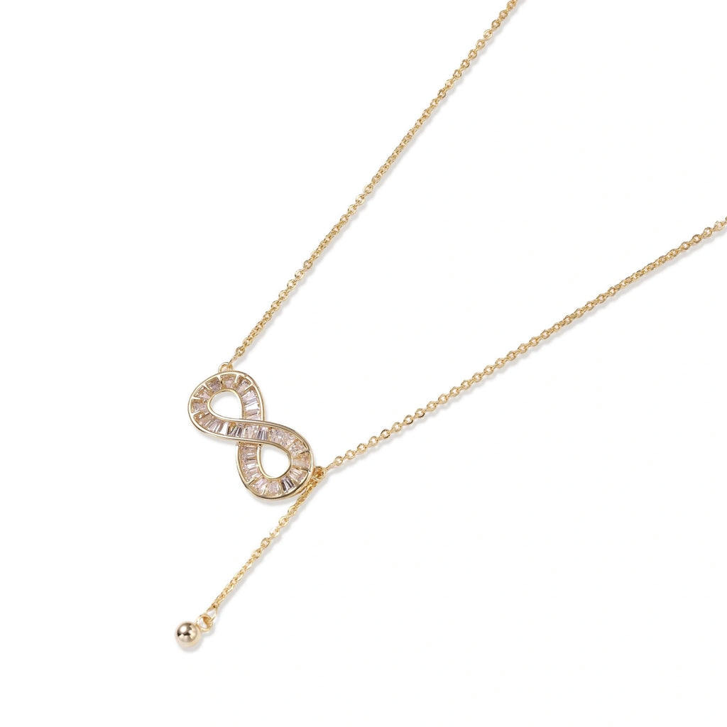 Close-up of the baguette crystal infinity necklace at the neckline