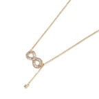 Close-up of the baguette crystal infinity necklace at the neckline