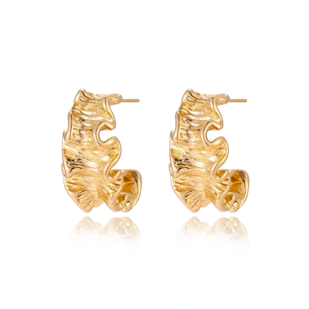 Model wearing Wave Flow Hoop Earrings - Gold Ruffled Texture