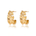 Model wearing Wave Flow Hoop Earrings - Gold Ruffled Texture