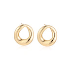 Model wearing Golden Loop Studs