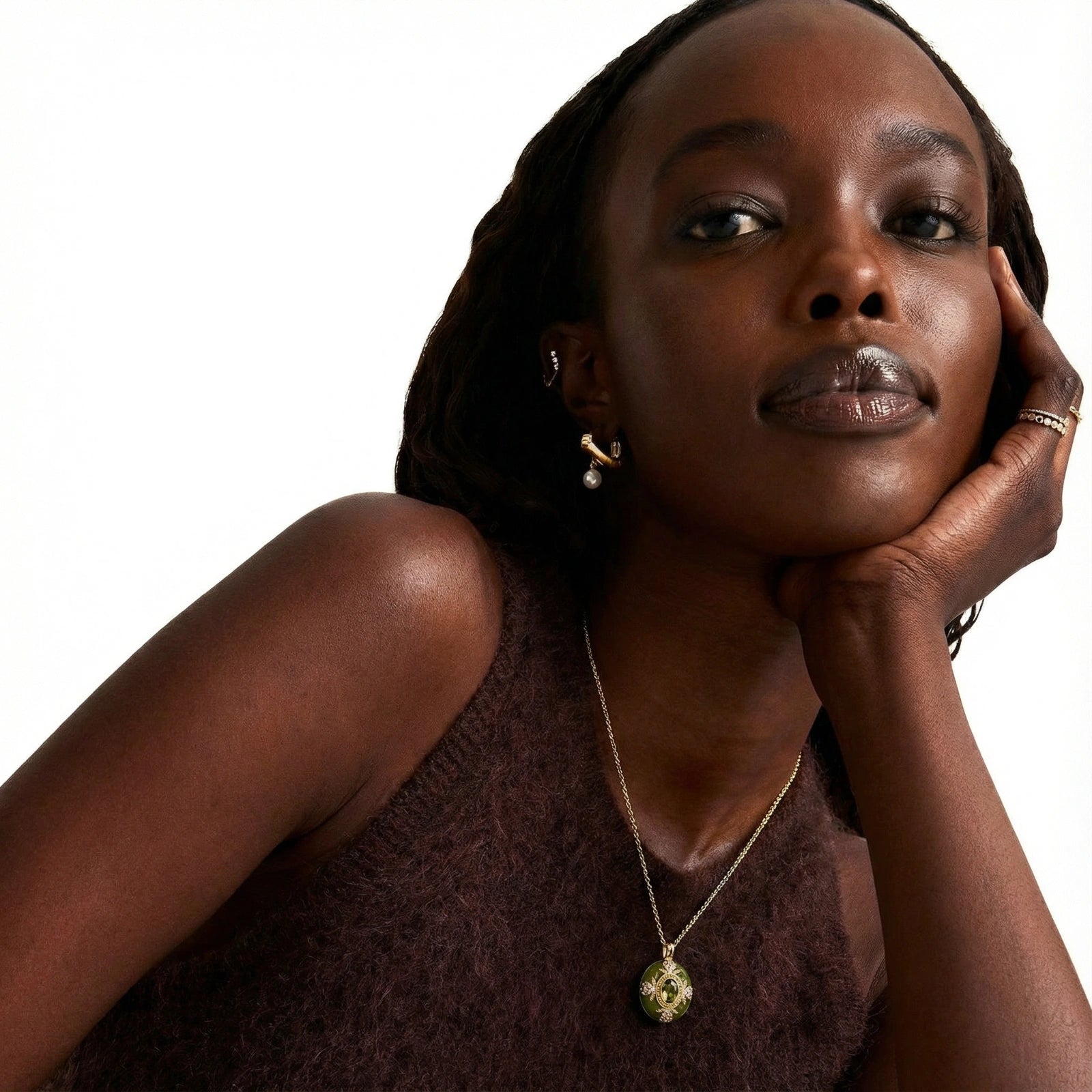 Woman wearing the emerald empress pendant necklace