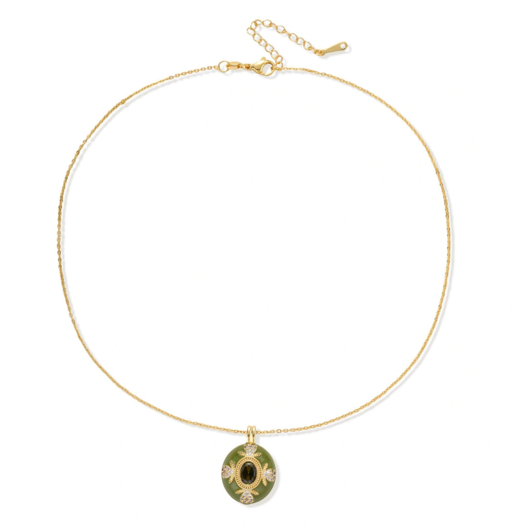 Minimalist view of the emerald empress pendant on a fine gold chain
