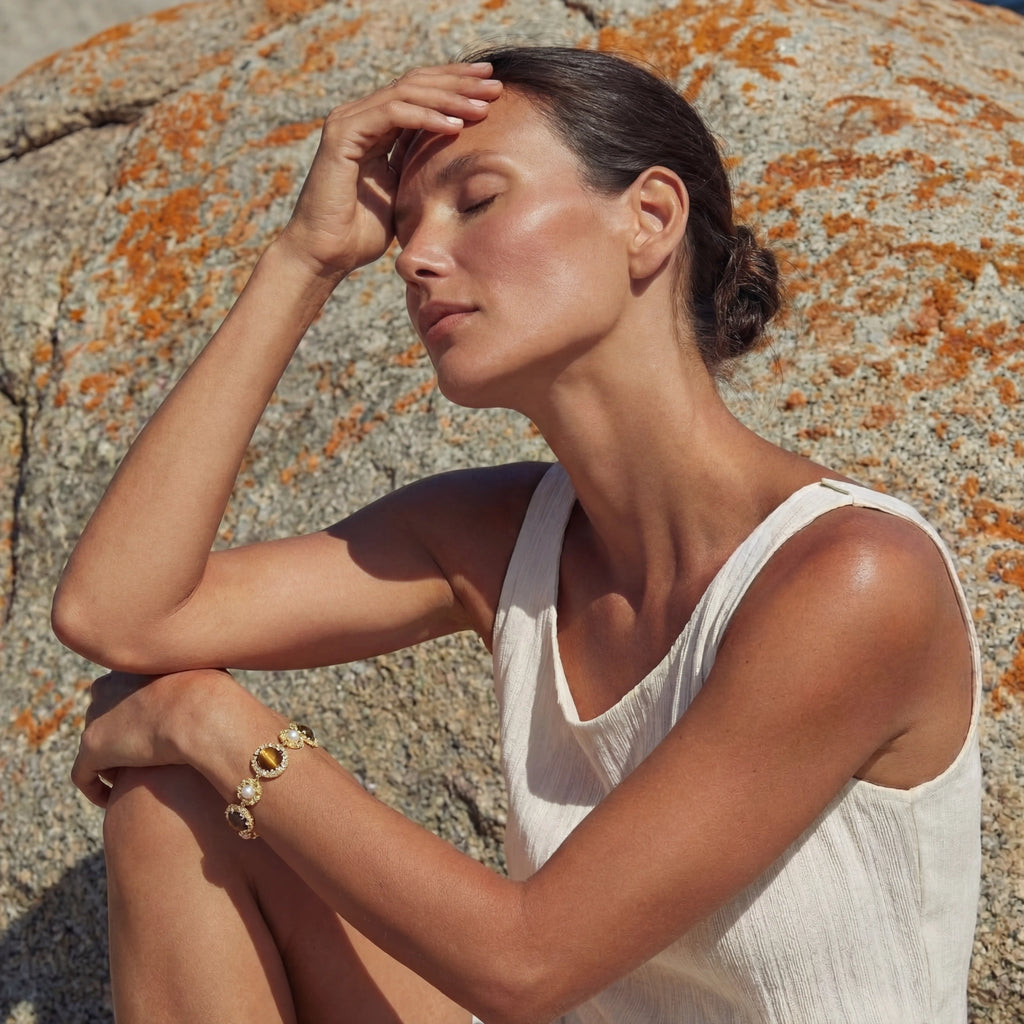 Model showing the tiger's eye pearl bracelet from behind