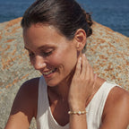 Close-up of the spiral pearl bracelet on the wrist